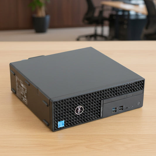 Refurbished Dell small form-factor computer tower on a desk in an office. 